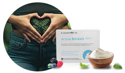 Haltende Hände auf Darm als Beispiel für natürliche Darmgesundheit mit Hilfe von probiotischem BRAVO-Joghurt